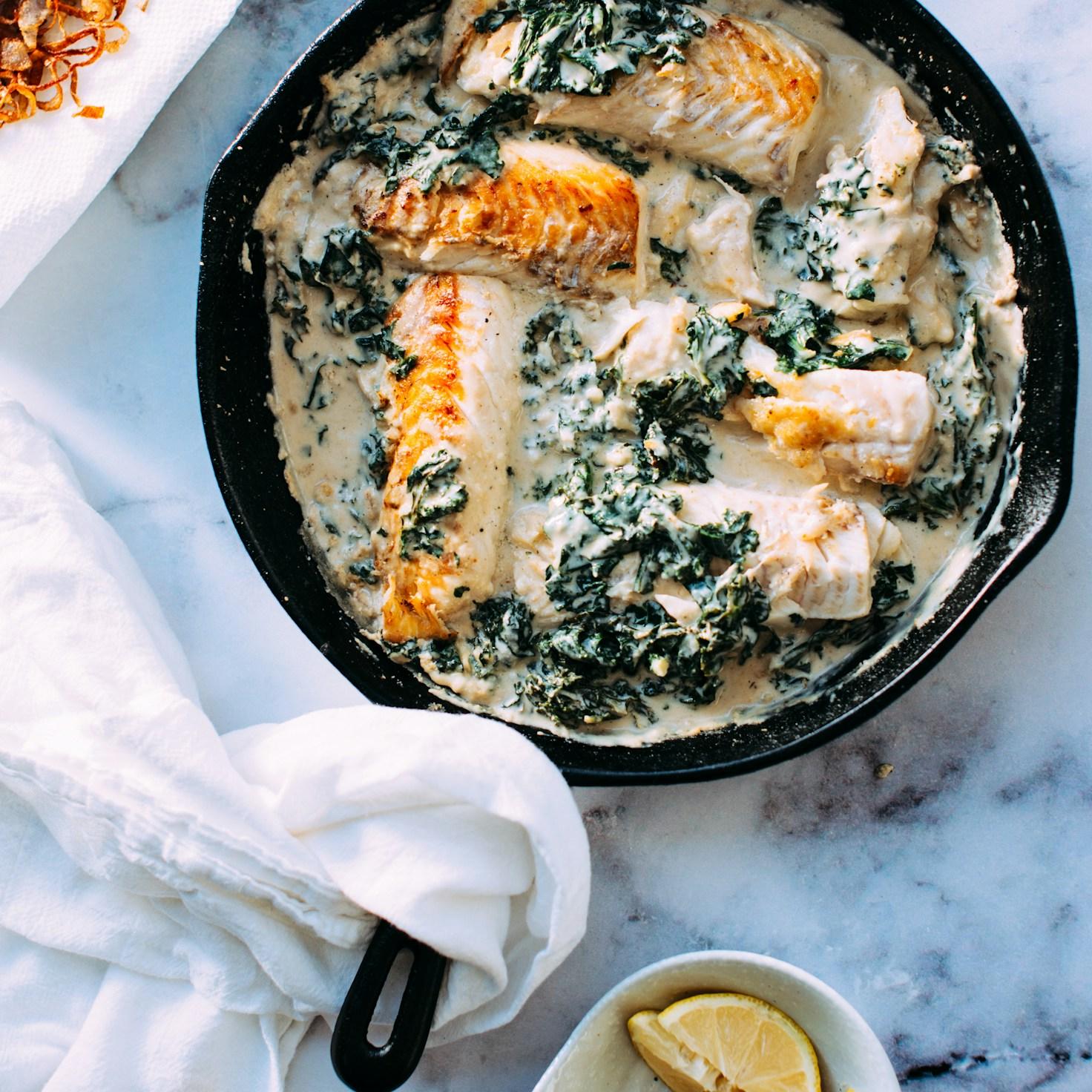 Friends in a contemporary kitchen collaborating, sharing recipes and cooking techniques